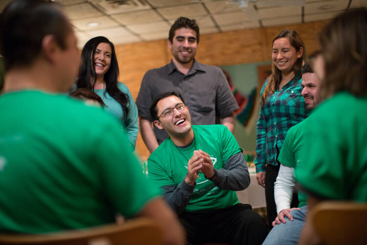 Marcos Gonzalez Villalba, center, meets with young adult leaders in the Diocese of Shreveport, La., in this undated photo. He is the first Hispanic youth and young adult coordinator for the diocese. (CNS photo/courtesy Catholic Extension) 