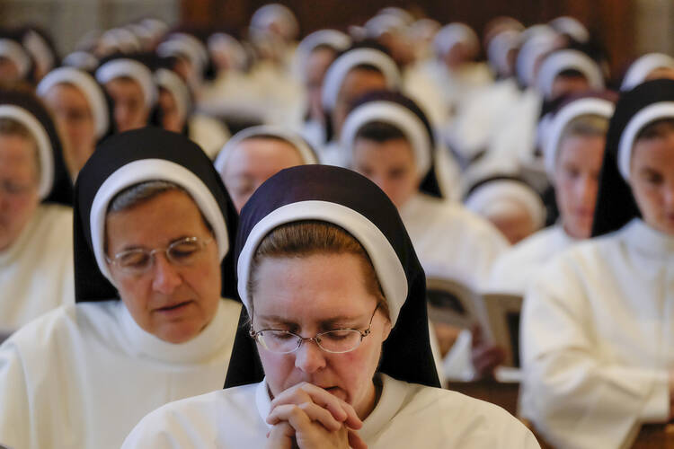 Dominican Sisters of St. Cecilia pray during Mass at the Cathedral of the Incarnation in Nashville, Tenn., on July 24, 2016. Members of religious orders who come from abroad and take a vow of poverty may find it more difficult to remain in the United States. (CNS photo/Rick Musacchio, Tennessee Register)