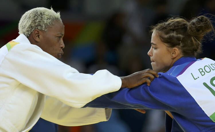 Refugee Olympic Team's Yolande Mabika, left, and Linda Bolder of Israel compete in judo during the Summer Olympics in Rio de Janeiro Aug. 10. (CNS photo/Toru Hanai, Reuters)