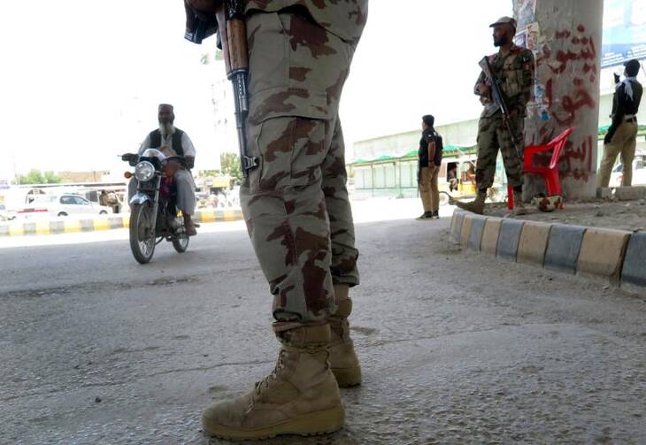 Pakistani security officials stand guard on a roadside in Quetta, Pakistan, Aug. 10. (CNS photo/Fayyaz Ahmed, EPA)