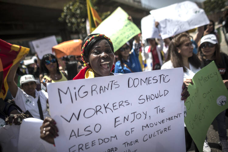 Women protest for better wages and working conditions for migrant domestic workers in Beirut May 1. Pope Francis prayed for all exploited women and girls during the feast of the Assumption at the Vatican Aug. 15. (CNS photo/Oliver Weiken, EPA)