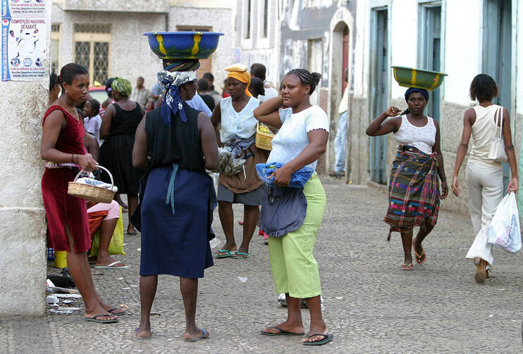 Women are seen near a market in Praia, Cape Verde, in this 2004 file photo. The African nation of half a million people has 7,500 confirmed cases of the Zika virus, but health officials suspect more cases are unreported. (CNS photo/Nic Bothma, EPA)