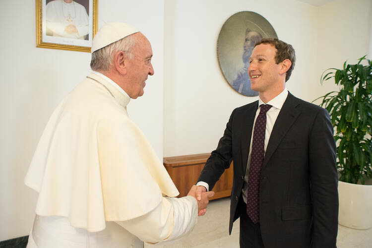 Thumbs Up. Pope Francis meets Mark Zuckerberg, CEO of Facebook, during a private audience at the Vatican Aug. 29. (CNS photo/L'Osservatore Romano, handout)