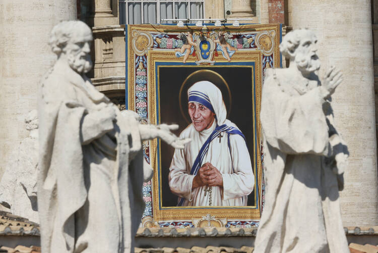 A tapestry of St. Teresa of Kolkata is seen on the facade of St. Peter's Basilica as Pope Francis celebrates her canonization Mass at the Vatican Sept. 4. (CNS photo/Paul Haring) 