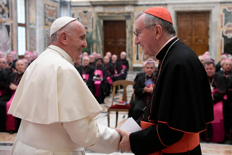 Pope Francis greets Cardinal Pietro Parolin, Vatican secretary of state, during a meeting with nuncios. (CNS photo/L'Osservatore Romano, handout)