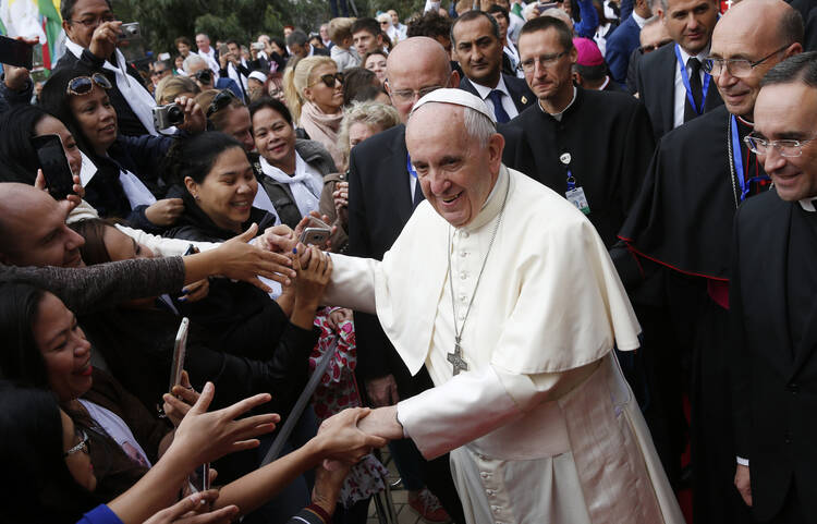 Pope Francis greets the faithful as he arrives to celebrate Mass at the Church of the Immaculate Conception in Baku, Azerbaijan, Oct. 2. (CNS photo/Paul Haring)