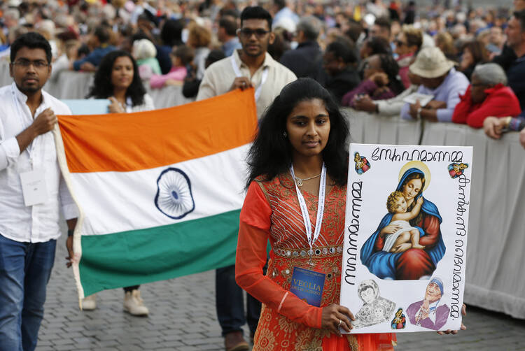  Devotees participate in a procession at the start of a Marian vigil led by Pope Francis in St. Peter's Square at the Vatican Oct. 8. (CNS photo/Paul Haring) 