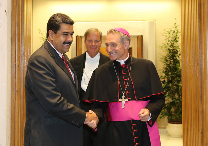 Venezuelan President Nicolas Maduro is greeted by Archbishop Georg Ganswein, prefect of the papal household, prior to an Oct. 24 private meeting between Maduro and Pope Francis at the Vatican. (CNS photo/Miraflores Palace handout via EPA)