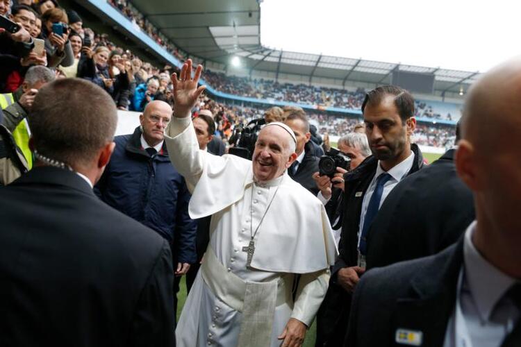 Pope Francis greets people before celebrating Mass at the Swedbank Stadium in Malmo, Sweden, Nov. 1. (CNS photo/Paul Haring)