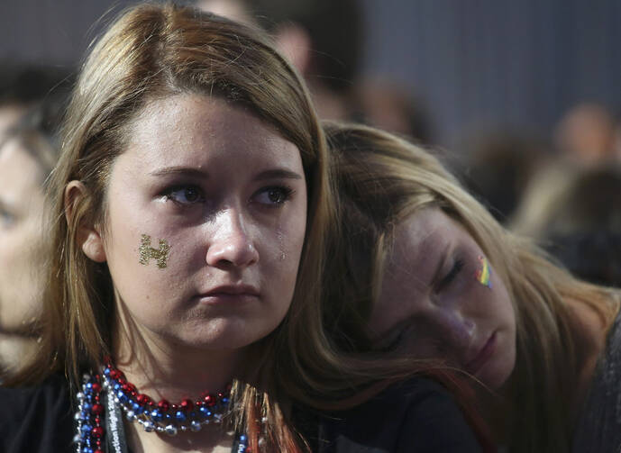 A supporter of Democratic presidential nominee Hillary Clinton reacts to the news that Republican presidential nominee Donald J. Trump won the election in the early morning hours of Nov. 9. (CNS photo/Adrees Latif, Reuters)