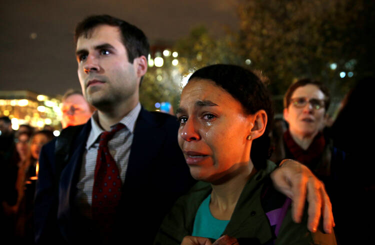 A woman cries while taking part in an anti-Trump vigil in front of the White House in Washington Nov. 9. (CNS photo/Kevin Lamarque, Reuters)