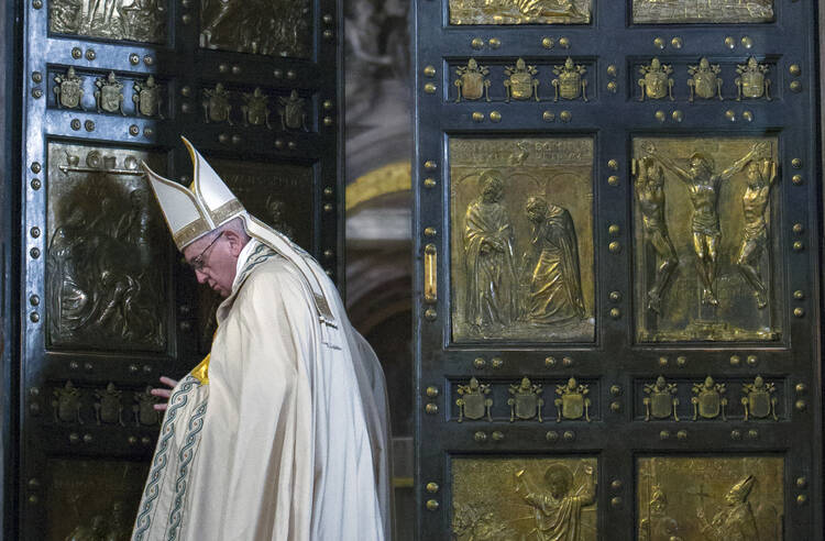 Pope Francis closes the Holy Door of St. Peter's Basilica before a Mass to conclude the Extraordinary Jubilee of Mercy at the Vatican Nov. 20. In concluding the Holy Year, the pope called for mercy to become a permanent part of the lives of believers. (CNS photo/Maria Grazia Picciarella, pool) 