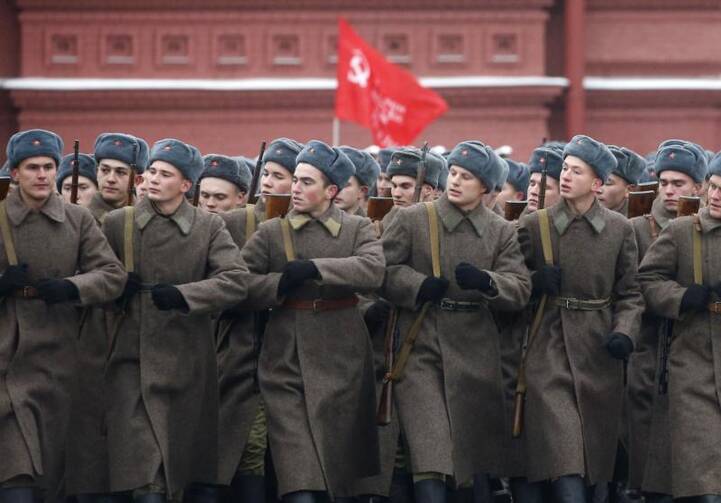 People in historical uniforms take part in the military parade in Moscow's Red Square in 2016. As preparations get underway for this year's 100th anniversary of the Russian Revolution, the country's small Catholic Church is keeping a low profile. (CNS photo/Maxim Shipenkov, EPA)