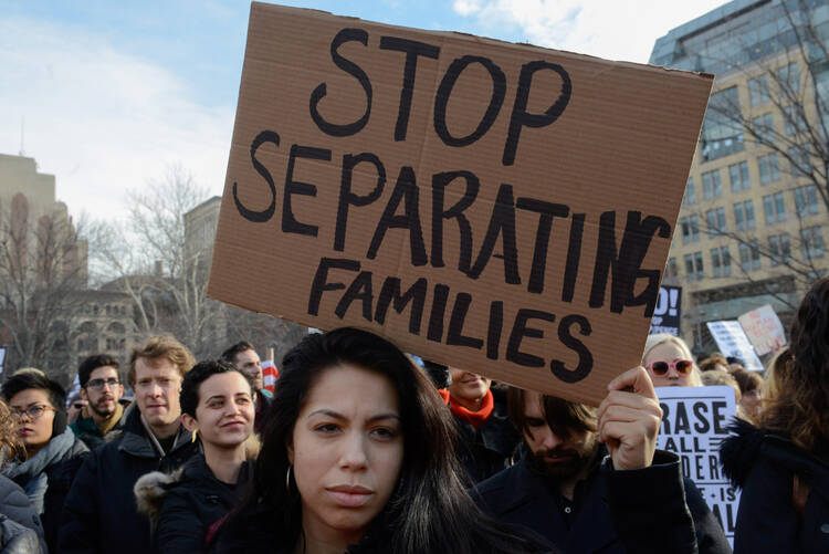 People participate in a protest on Feb. 11 against U.S. President Donald Trump's immigration policy and the recent Immigration and Customs Enforcement raids in New York City. (CNS photo/Stephanie Keith, Reuters)