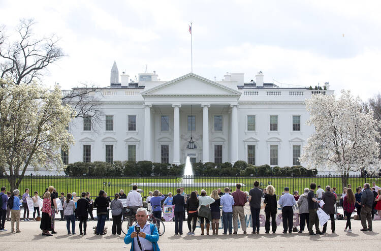 Peace activists gather for an Ash Wednesday prayer service outside the White House in Washington on March 1. (CNS photo/Tyler Orsburn)