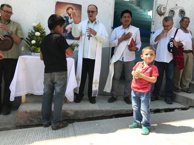 Mexican Coadjutor Bishop Enrique Diaz Diaz of San Cristobal de Las Casas blesses a new shelter for migrants Feb. 27 on the Mexico-Guatemala border. The shelter will house families seeking asylum in Mexico. (CNS photo/David Agren) 