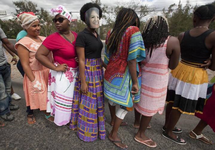 Women in Tegucigalpa, Honduras, protest the 2016 murder of environmental activist Berta Caceres March 1. (CNS photo/Gustavo Amador, EPA)