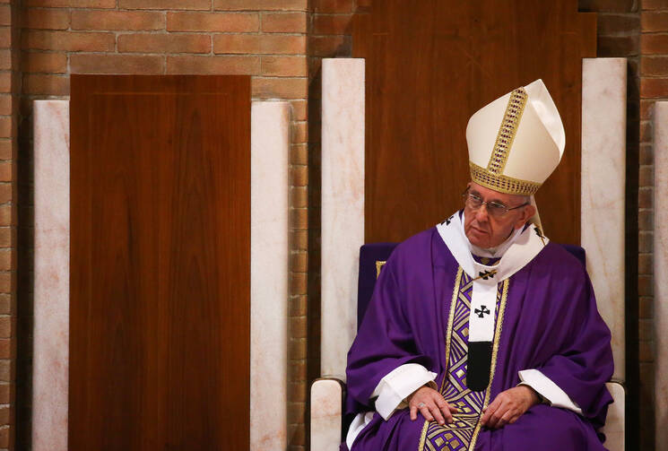 Pope Francis celebrates Mass on March 12 at the Rome parish of St. Magdalene of Canossa. (CNS photo/Alessandro Bianchi, Reuters)