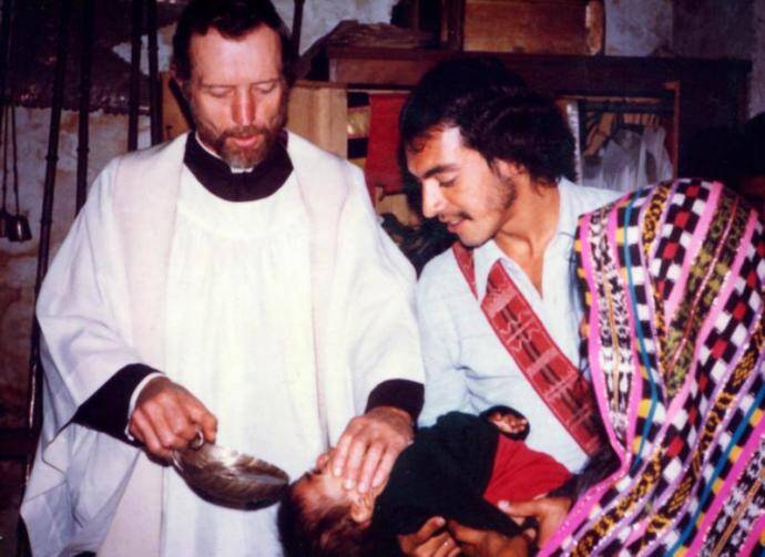 Father Stanley Rother, a priest of the Oklahoma City Archdiocese who was brutally murdered in 1981 in the Guatemalan village where he ministered to the poor, is shown baptizing a child in this undated photo. The Archdiocese of Oklahoma City announced the North American priest will be beatified on Sept. 23 in Oklahoma. (CNS)