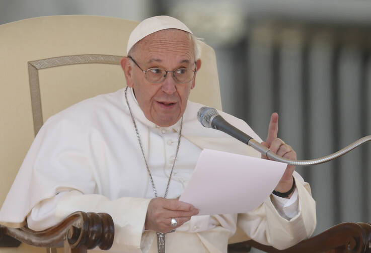 Pope Francis speaks during his general audience in St. Peter's Square at the Vatican March 15. (CNS photo/Paul Haring) 