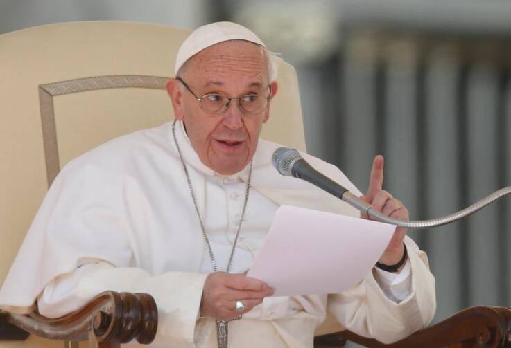 Pope Francis speaks during his general audience in St. Peter's Square at the Vatican on March 15. (CNS photo/Paul Haring) 