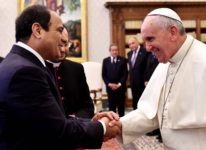 Pope Francis and Egypt's President Abdel Fattah al-Sisi shake hands during a private audience in 2014 at the Vatican. (CNS photo/Gabriel Bouys pool, via Reuters)