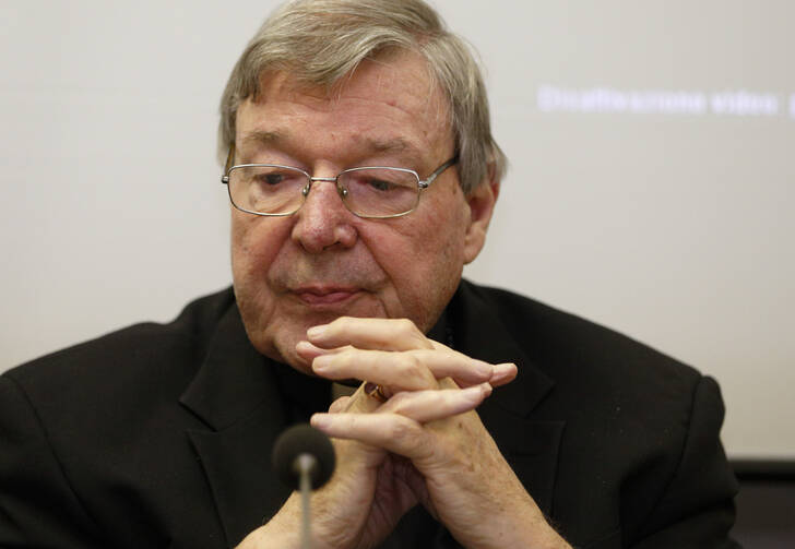 Australian Cardinal George Pell, prefect of the Vatican's Secretariat for the Economy, attends the presentation of the book, "Connected World," at the Vatican on March 28. (CNS photo/Paul Haring)