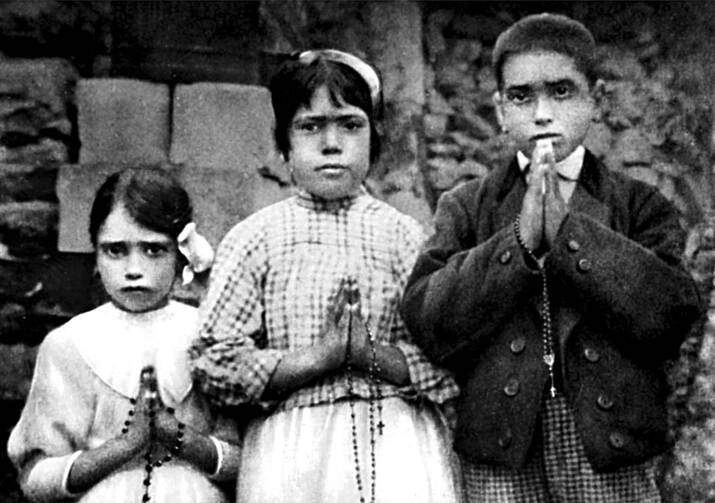 Portuguese shepherd children Lucia dos Santos, center, and her cousins, Jacinta and Francisco Marto, are seen in a file photo taken around the time of the 1917 apparitions of Mary at Fatima. (CNS photo/EPA)