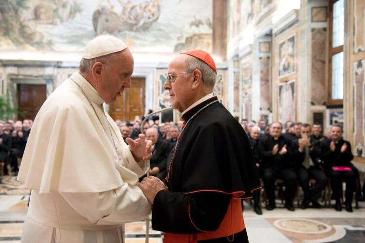 Pope Francis greets Cardinal Ricardo Blazquez Perez of Valladolid, Spain, during an audience with seminarians and faculty of the Pontifical Spanish College of St. Joseph at the Vatican on April 1. (CNS photo/L'Osservatore Romano, handout)