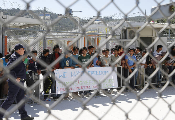 Refugees wait to see Pope Francis at the Moria refugee camp on the island of Lesbos, Greece, in this April 16, 2016, file photo. (CNS photo/Paul Haring)