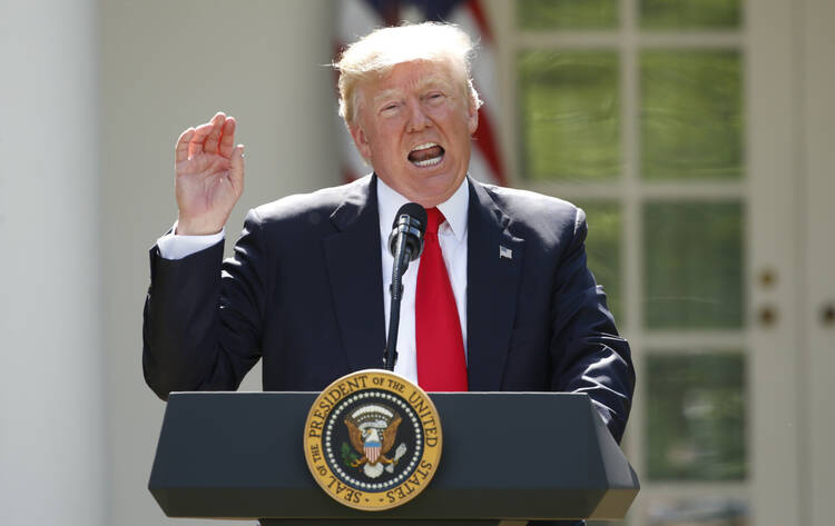 U.S. President Donald Trump announces his decision to withdraw from the Paris climate agreement at the White House in Washington on June 1. (CNS photo/Kevin Lamarque, Reuters)
