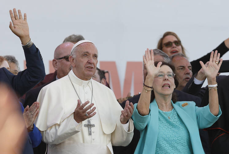 Pope Francis and Patti Gallagher Mansfield, a participant in the 1967 Pittsburgh retreat that marked the beginning of the Charismatic renewal, pray during a Pentecost vigil marking the 50th anniversary of the Catholic charismatic renewal at the Circus Maximus in Rome on June 3. (CNS photo/Paul Haring)