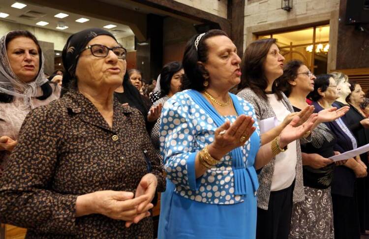 Worshippers pray in 2016 at the Church of our Lady of Perpetual Help in Ankawa, Iraq. (CNS photo/Ahmed Jalil, EPA)