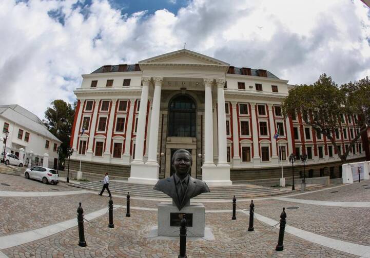 A statue of Nelson Mandela is seen in early April outside the South African Parliament building in Cape Town. Following findings of severe corruption in government, the South African Council of Churches called for the dissolving of parliament and new general elections. (CNS photo/Nic Bothma, EPA)