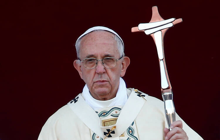 Pope Francis celebrates Mass on the feast of Corpus Christi June 18 outside Rome's Basilica of St. John Lateran. (CNS/Tony Gentile, Reuters)