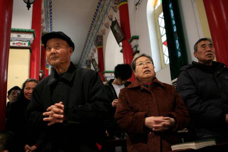 Chinese Catholics pray during Mass in 2007 at St. Francis Cathedral in Xi'an. (CNS photo/Nancy Wiechec)