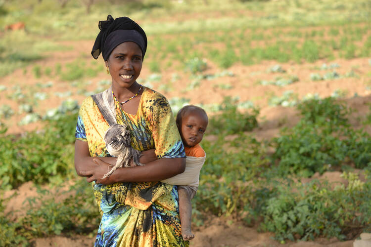 Anisa Gourate and her son, Muhammad, pose in 2015 on their farm near Jijiga, Ethiopia. With support from the Canadian Catholic Organization for Development and Peace the Gourate family has a livelihood that will support their healthy young family. (CNS photo/Michael Swan, Catholic Register) 
