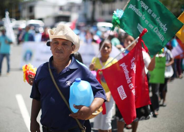 Protesters in San Salvador, El Salvador, demand that lawmakers provide water access to the poor in this July 2017 photo. (CNS photo/Jose Cabezas, Reuters)