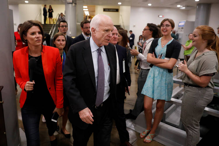 Sen. John McCain, R-Ariz., speaks with reporters ahead of a health care vote July 27 on Capitol Hill in Washington. (CNS photo/Aaron P. Bernstein, Reuters)