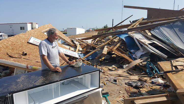Lin Barton surveys the damage at the marina in Rockport where he has lived and worked. (Photos by Jan-Albert Hootsen)