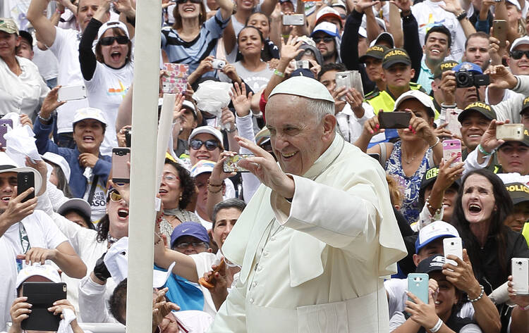  Pope Francis greets the crowd before celebrating Mass at Enrique Olaya Herrera Airport in Medellin, Colombia, Sept. 9. (CNS photo/Paul Haring) 