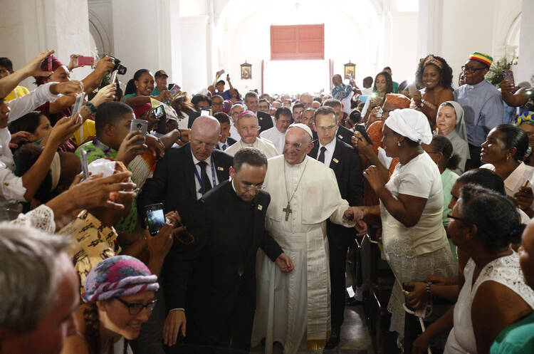 Pope Francis greets people as he arrives to visit the Shrine of St. Peter Claver in Cartagena, Colombia, on Sept. 10. (CNS photo/Paul Haring)