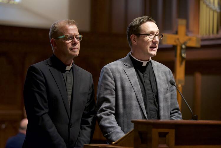 Jesuit Father Gregory Schenden, campus chaplain at Georgetown University and the Rev. Bryant Oskvig, Protestant chaplaincy director on the campus, speak in a joint address on Sept. 15 during the university's "1517-2017: Lutherans and Catholics: Then and Now" conference in Washington. (CNS photo/Rafael Suanes, courtesy Georgetown University)