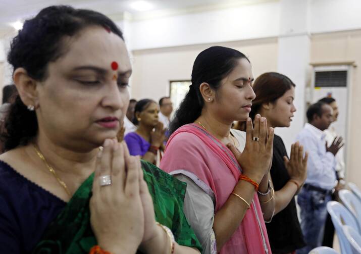 Hindu women pray for peace Oct. 1 at the Sri Bunar Maha Shiva Hindu temple in Yangon, Myanmar. Peace and harmony will not result from members of different religions simply tolerating each other; respect and appreciation of customs and cultural diversity is required, top Vatican officials said in a message to the world's Hindus. (CNS photo/Nyein Chan Naing, EPA)