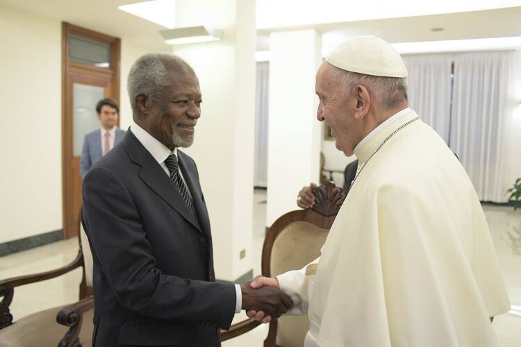 Pope Francis greets Kofi Annan, former secretary-general of the United Nations and leader of The Elders, during a private audience at the Vatican on Nov. 6. (CNS photo/L'Osservatore Romano)