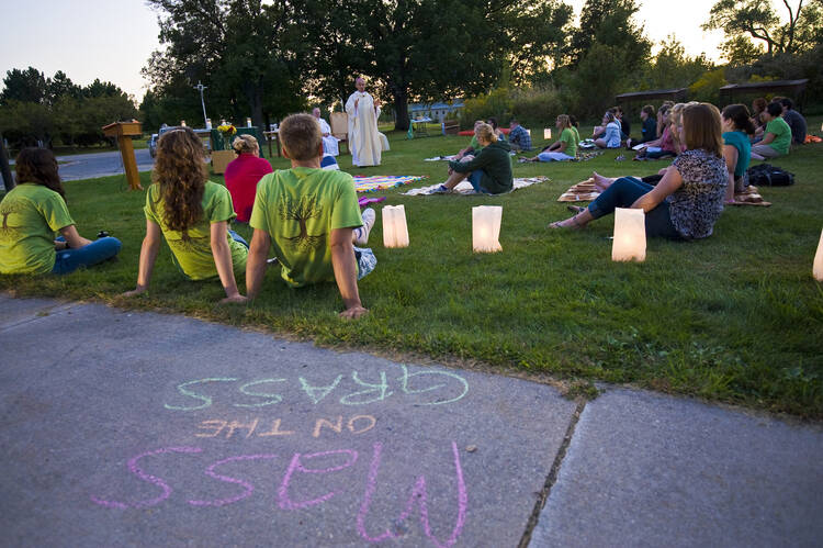 Auxiliary Bishop Robert F. Morneau of Green Bay, Wis., delivers his homily during the 2011 outdoor “Mass on the Grass” welcoming students to the University of Wisconsin at Green Bay. (CNS photo/Sam Lucero, The Compass)