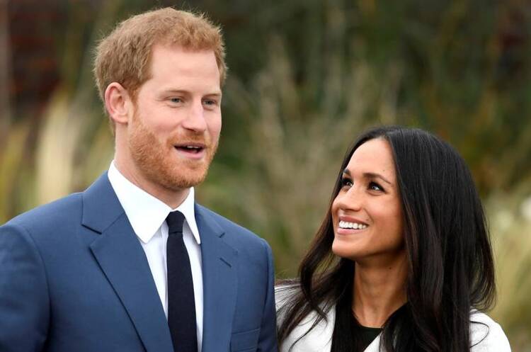 Britain's Prince Harry poses with Meghan Markle on Nov. 27 in the Sunken Garden of Kensington Palace in London after announcing their engagement. Markle attended Immaculate Heart High School in Los Angeles. (CNS photo/Toby Melville, Reuters)