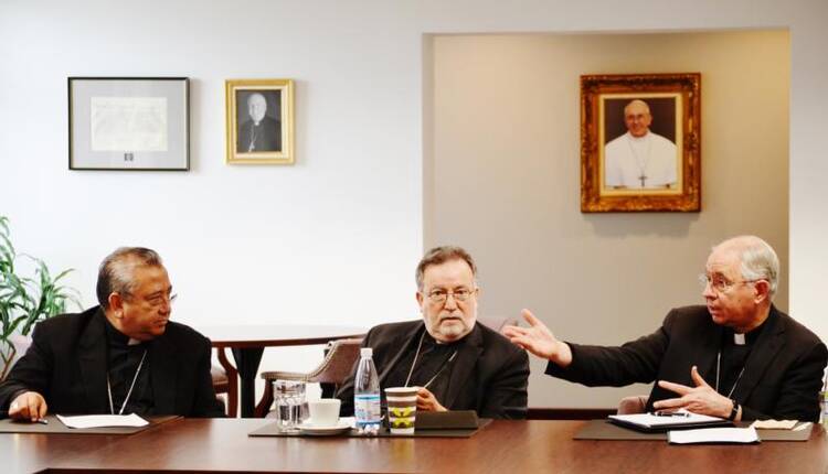 Mexican Archbishop Francisco Moreno Barron of Tijuana and Bishop Jaime Soto of Sacramento, Calif., look on as Archbishop Jose H. Gomez of Los Angeles speaks on Oct. 30 during "Encuentro de los Obispos de Alta y Baja California" at the Diocese of San Diego pastoral center. Archbishop Gomez is vice president of the U.S. Conference of Catholic Bishops. (CNS photo/Aida Bustos, Diocese of San Diego)