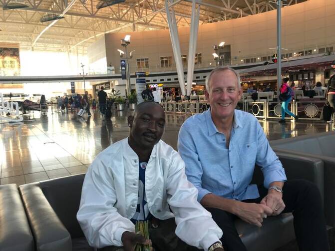 During his first year of adjusting to life in the United States, Sudanese refugee Bershlmaws "Alo" Koko has relied upon the guidance and friendship of Fritz French, a member of Immaculate Heart of Mary Parish in Indianapolis. French is a volunteer mentor with the Indianapolis Archdiocese's Refugee and Immigrant Services program of Catholic Charities. (CNS photo/John Shaughnessy, The Criterion)