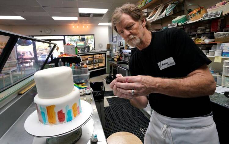Baker Jack Phillips decorates a cake in his Masterpiece Cakeshop Sept. 21 in Lakewood, Colo. The Supreme Court was set to hear oral arguments Dec. 5 in the case of the baker who cited religious freedom in his refusal to design a wedding cake for a same-sex couple. (CNS photo/Rick Wilking, Reuters)